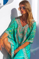 Aqua silk beach cover ups to wear to the beach by Lindsey Brown