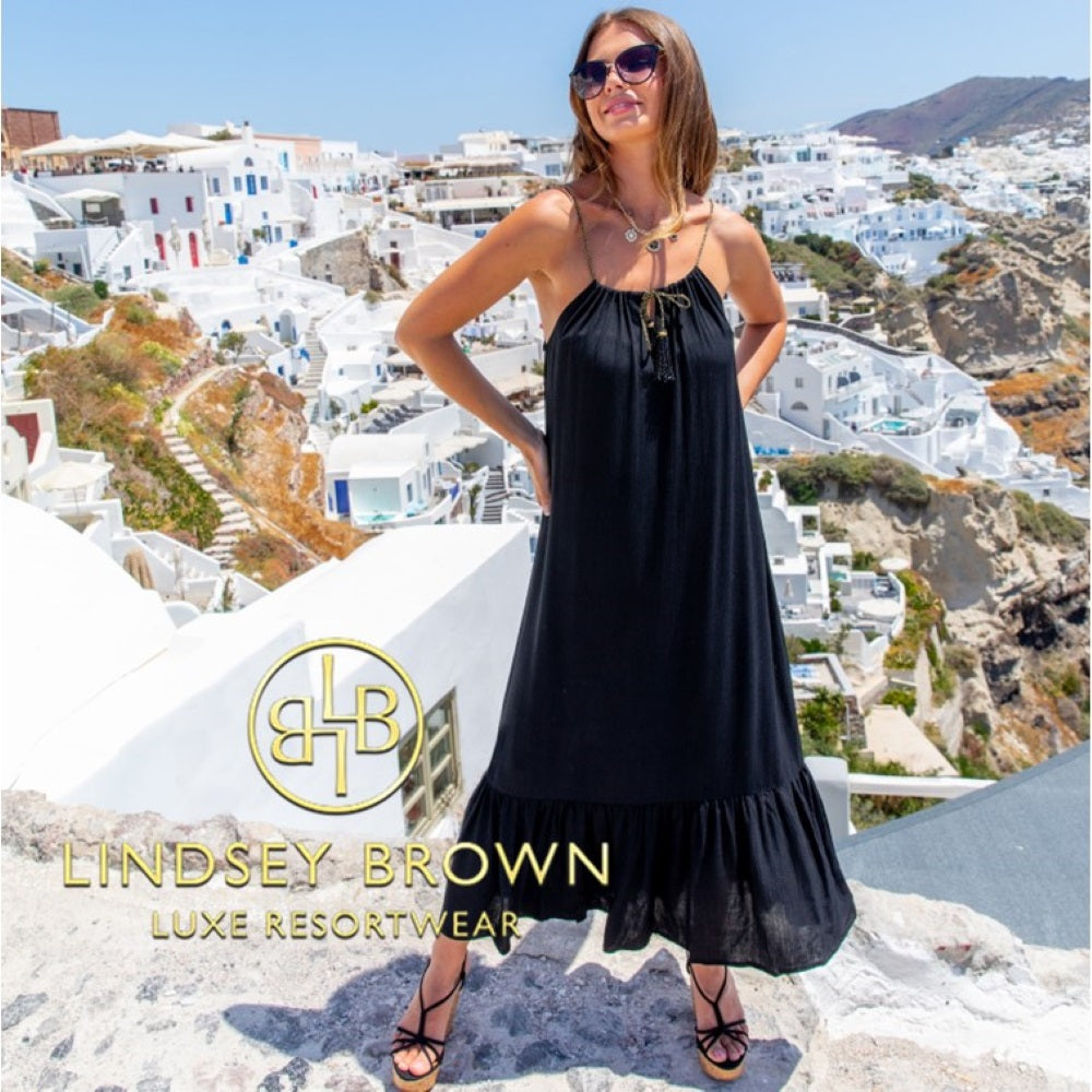 Black floaty cotton designer holiday dresses by Lindsey Brown luxury resort wear