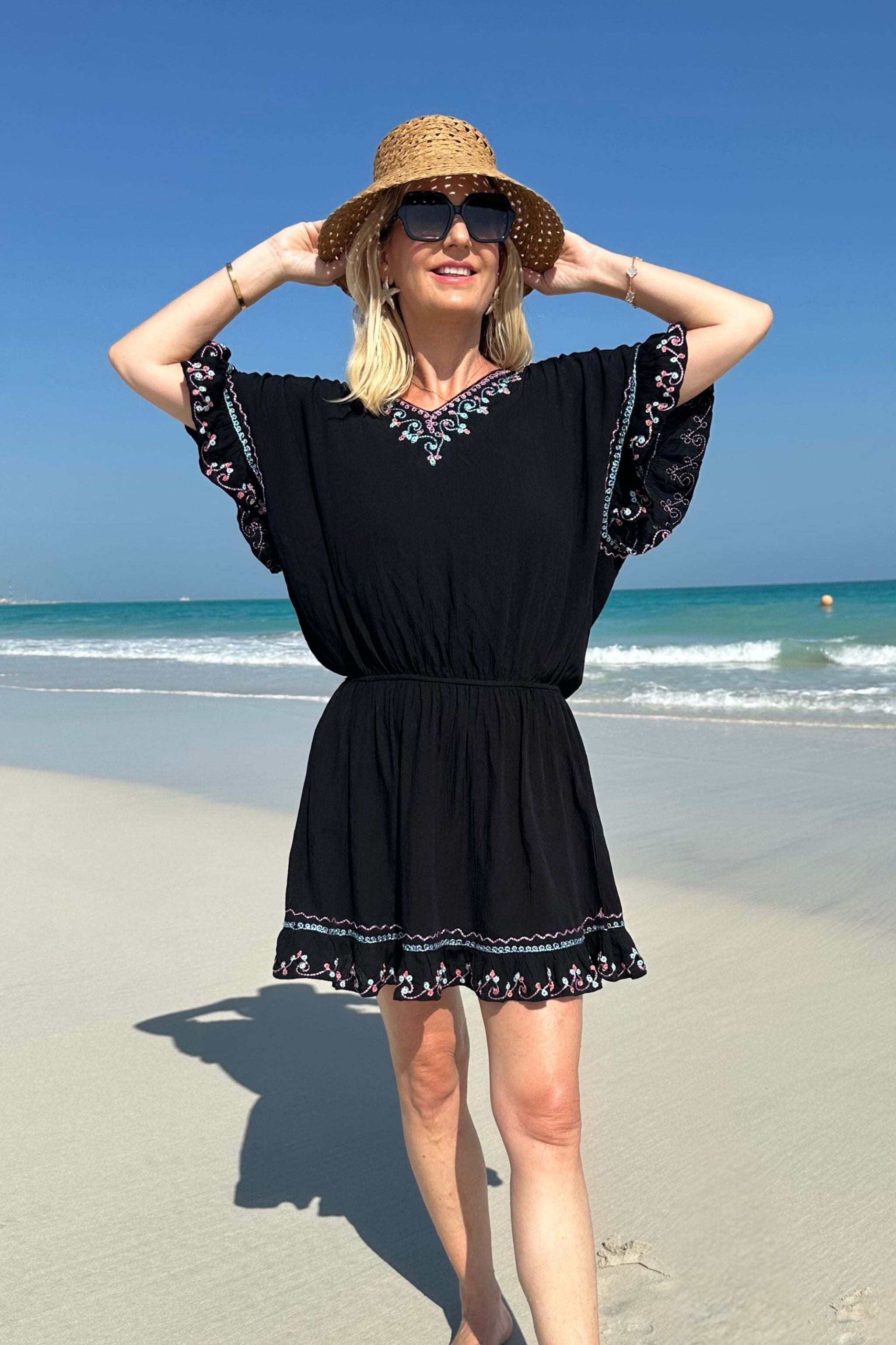 Black cotton bloused beach dress to wear on holiday by Lindsey Brown resort wear