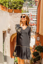 Black gold beach dress to wear on holiday by Lindsey Brown resort wear