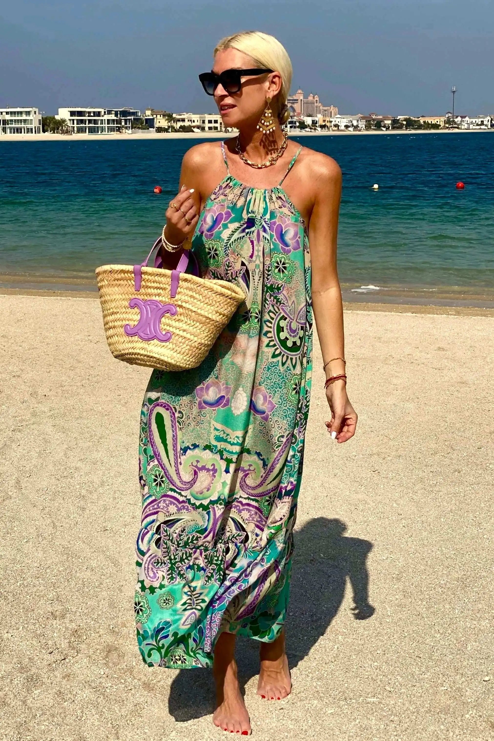 Silk printed maxi dresses to wear on holiday by Lindsey Brown luxury resort wear