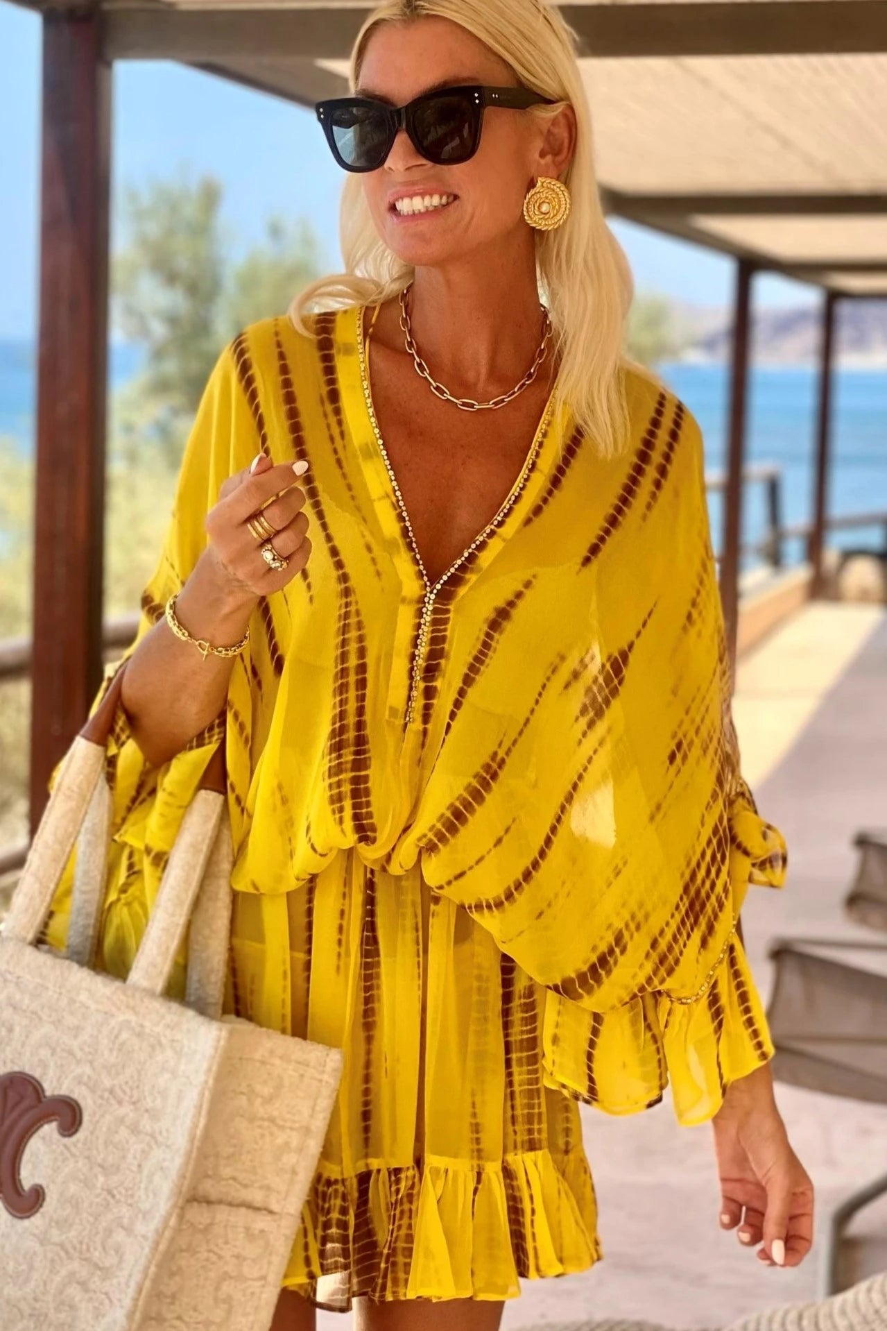 Silk-yellow-kaftans-worn-by-Anna-Mavridis-wears-Lindsey-Brown-yellow-silk-resort-wear