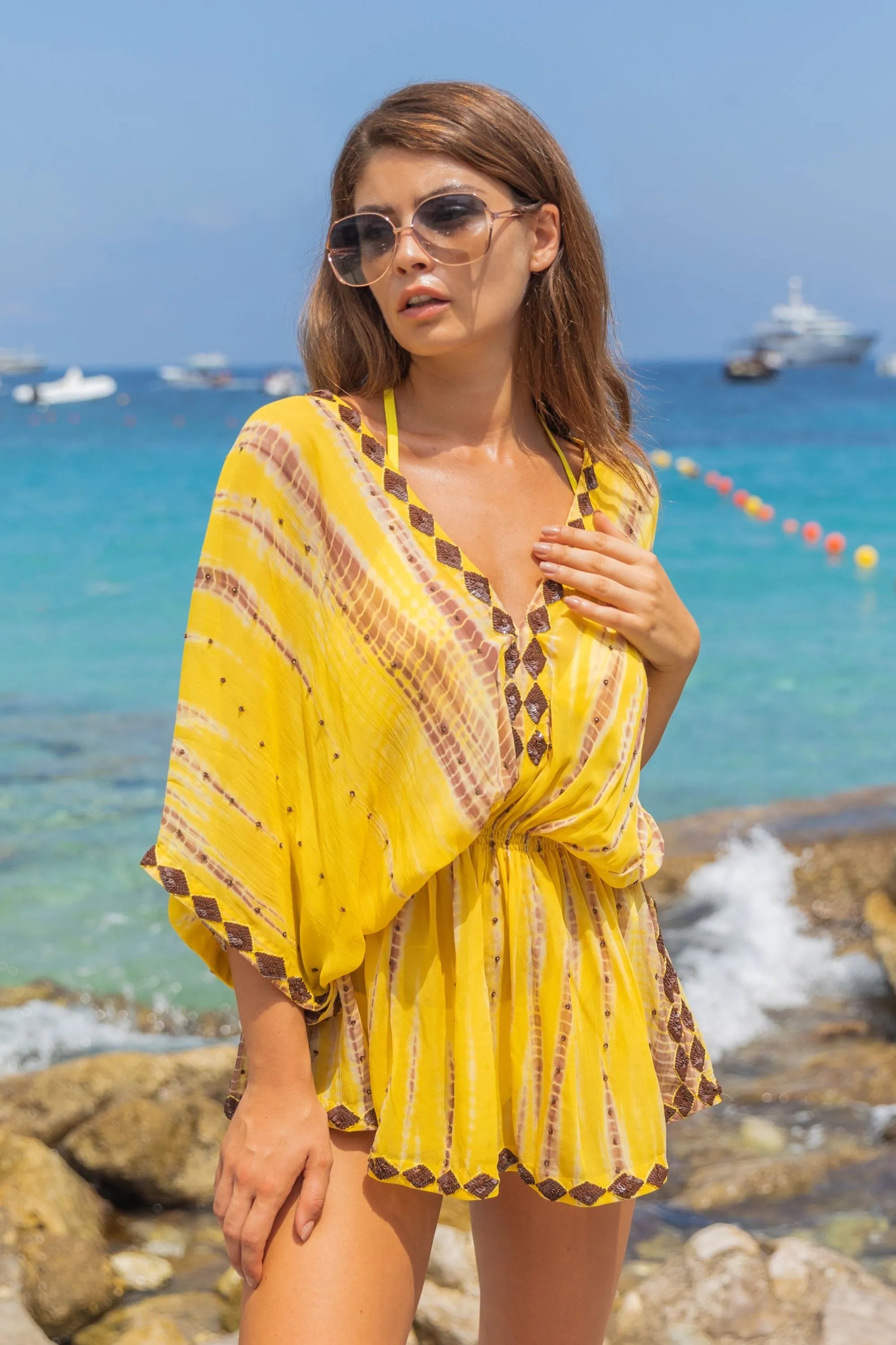 yellow short silk designer kaftans to wear on holiday by luxury resort wear by Lindsey Brown luxury resort wear 