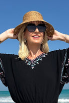 Black cotton beach dress to wear on holiday by Lindsey Brown resort wear 