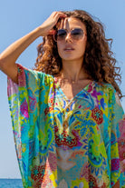 turquoise floaty silk beach cover up by Lindsey Brown luxury resort wear